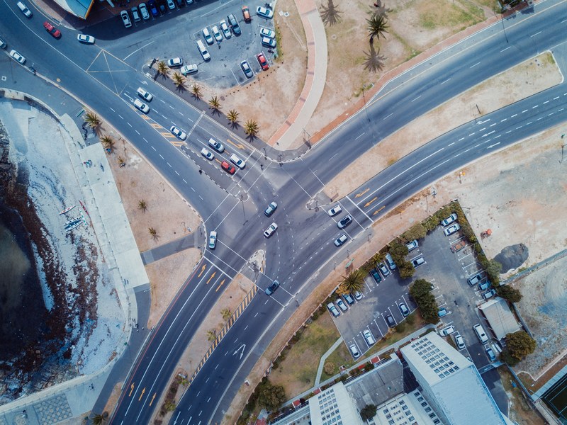 drone aerial view of the freeway intersection with cars and parking lots in sea point, drone view aerial view road and freeway 4k