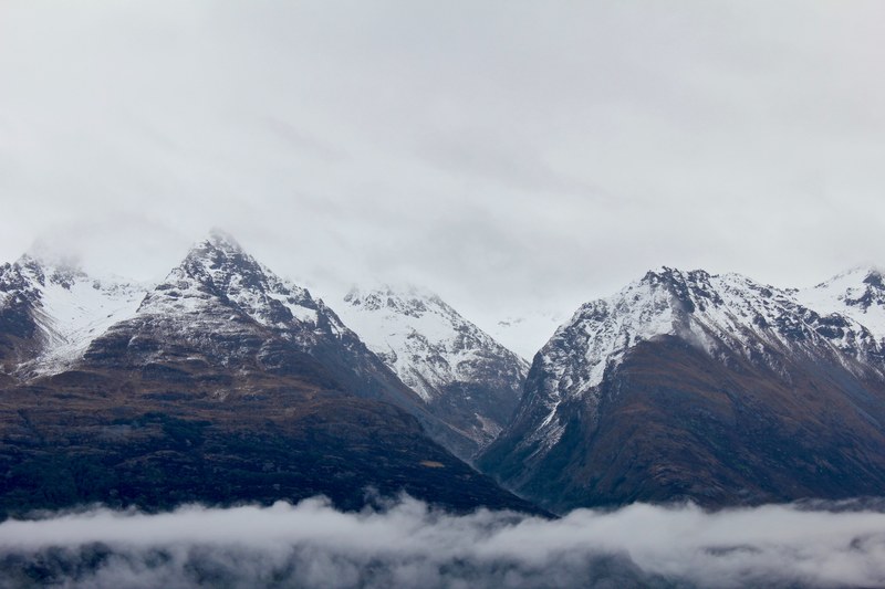 snow covered mountain peaks surrounded by clouds in queenstown, _snow capped mountains 4k