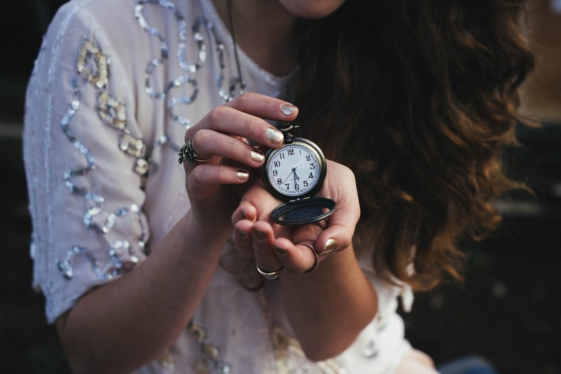 a woman holding an old pocket watch, woman with an old pocket watch 4k