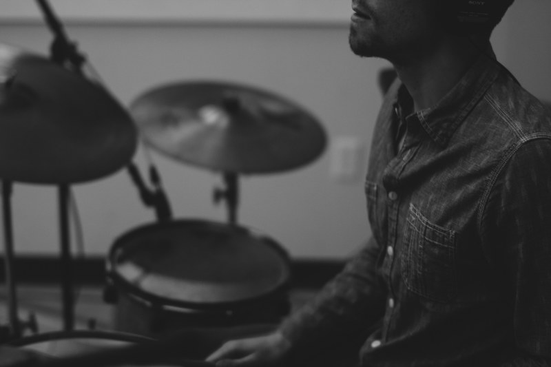 a man playing the drums at capital university, capital university drummer 4k