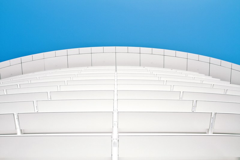 a low angle shot of a white facade with white panels, white panels on modern facade 4k