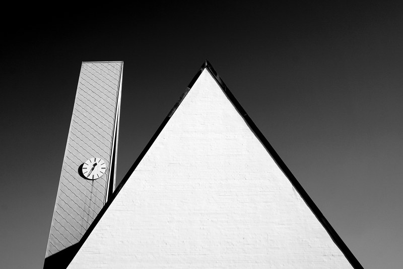 abstract black and white shot of triangle and clock tower frth bavaria germany, erlserkirche 4k