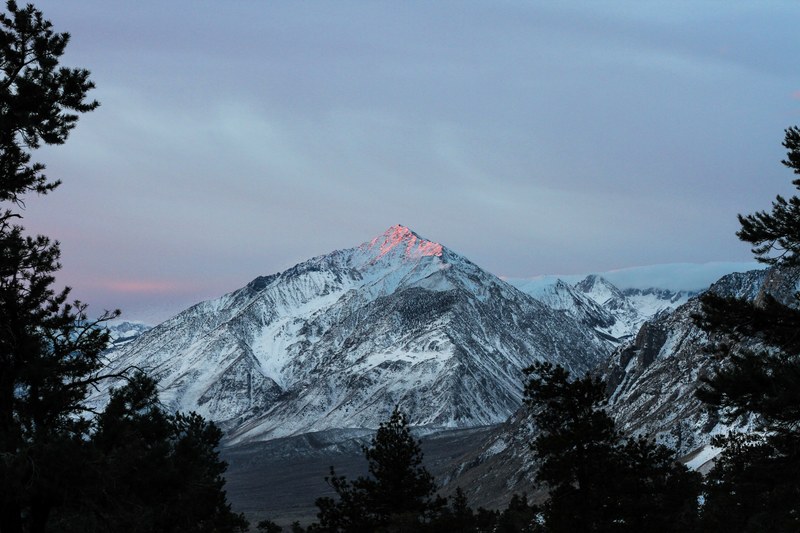 the peak of the tall mount whitney bathed in red sunshine during sunset, good morning from mount whitney 4k