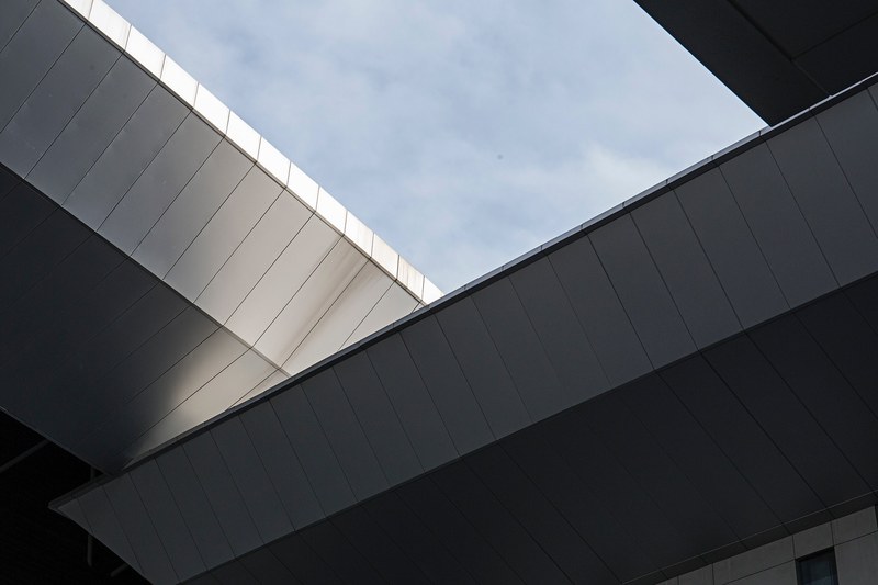 a skylight in a ceiling of white metal plates, skylight in industrial ceiling 4k