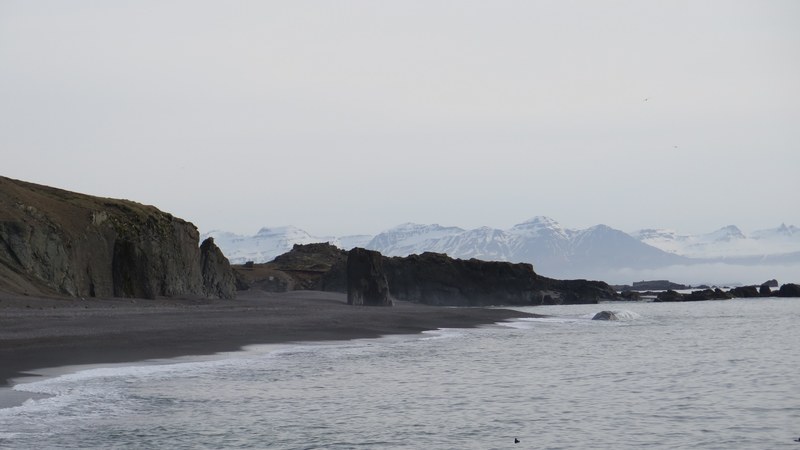 sand rock mountain range and black sand 4k