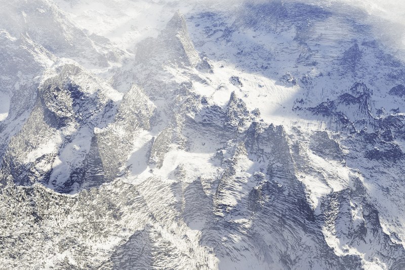sharp rock edges on a snow covered mountain, snowy mountain edges 4k