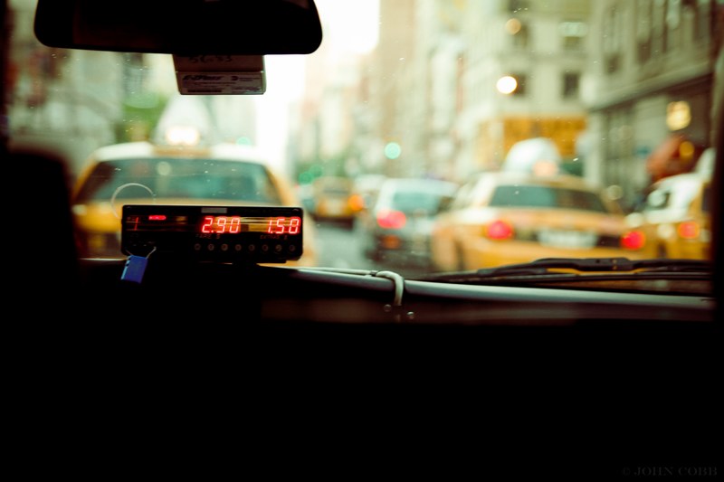 sitting backseat in a city taxi cab watching the fare increase, cab fare 4k
