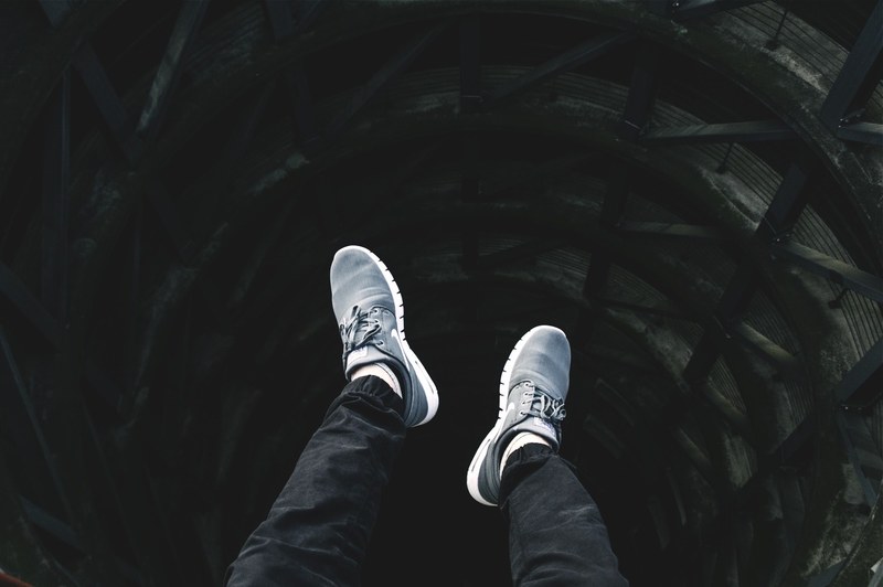 black sneaker shoe and person 4k