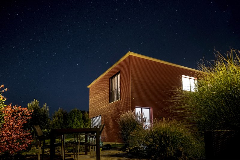 cabin window night sky and wooden house 4k