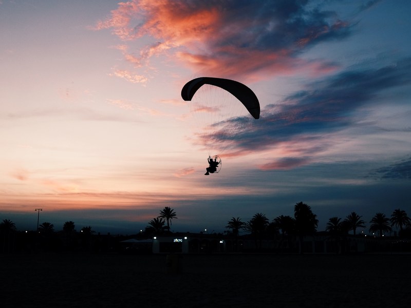 sunset sky parachuting and paragliding 4k