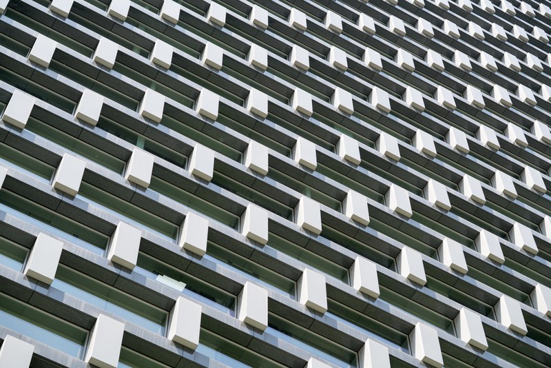 a regular geometric pattern in a white and gray facade, geometric gray facade 4k