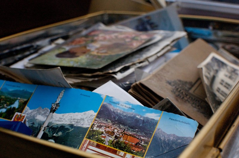 a box full of german literature scraps of paper and tourist leaflets in a box, box of german papers 4k