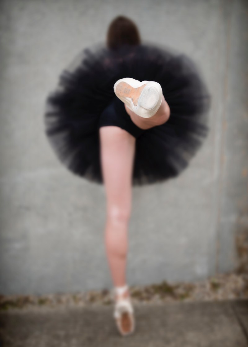 a ballerina wearing a tutu and pointe shoes in charlevoix, charlevoix ballerina 4k