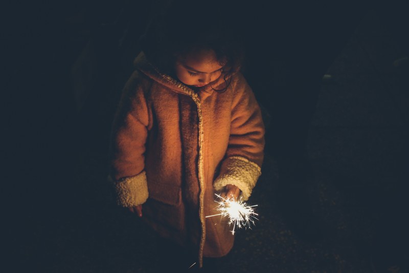 child holding firework sparkler child and firework 4k
