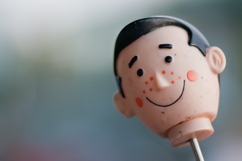 face details on a vintage toy doll head, vintage toy 4k
