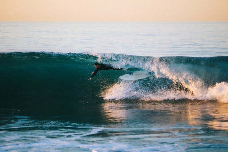 surfer jumping from the surfboard on the wave at 54th street, surfer on the wave 4k