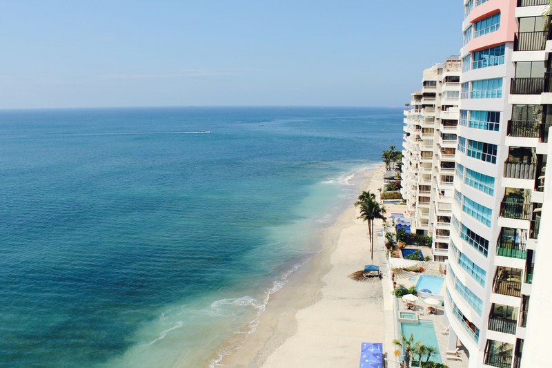hotel apartments on the sand beach shoreline, hotel on the shoreline 4k