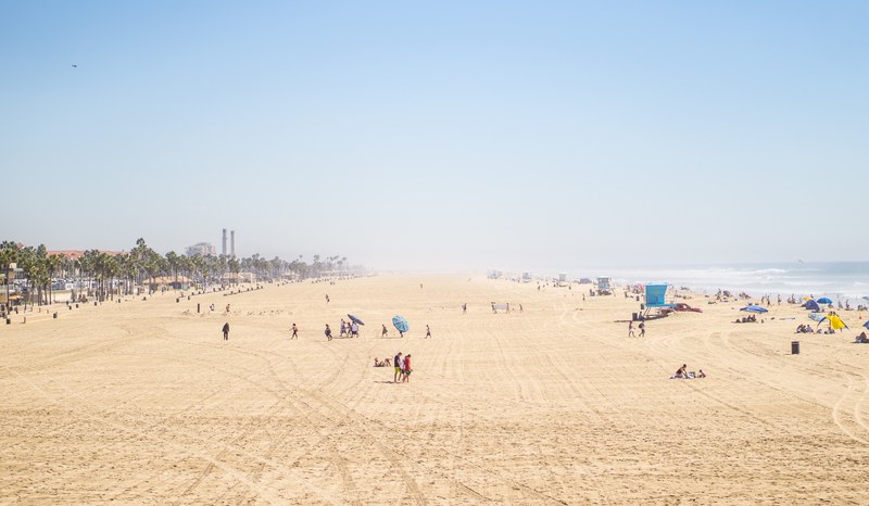 large sea shore proves to be huge tourist attraction at the beach during summer, large seashore on a hot summer day 4k