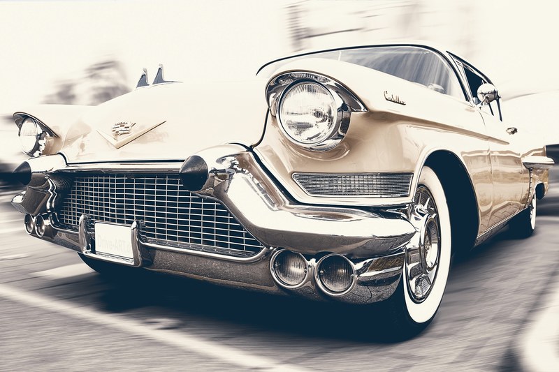 close up shot of vintage beige cadillac with chrome grille parked on pavement, vintage beige cadillac 4k