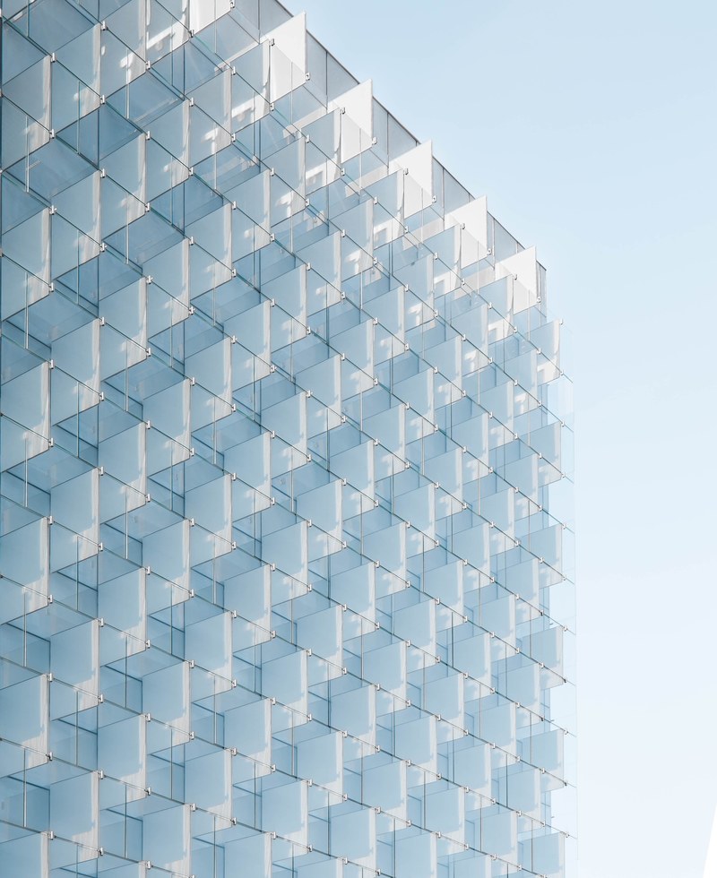 regular glass plates in the facade of an office building in madrid, regular glass facade 4k
