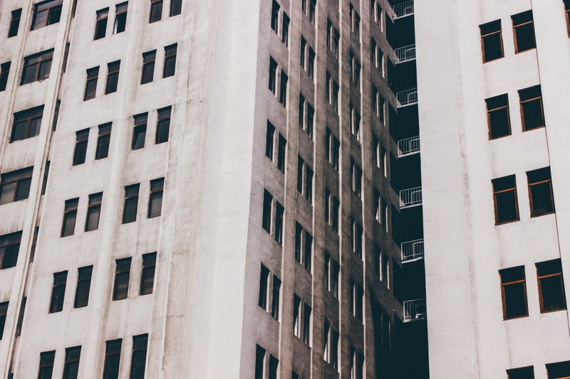 tall gray urban building exterior with windows in baku, building windows in baku 4k
