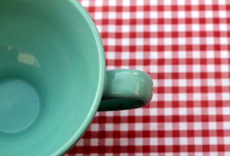 mint green mug on red gingham table, teal mug over gingham cloth 4k