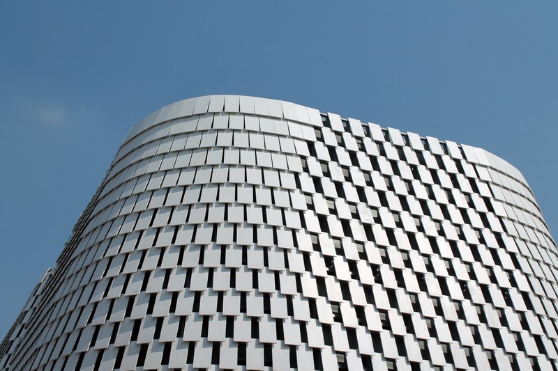 a building facade covered with white plates in milan, white plates on a facade 4k