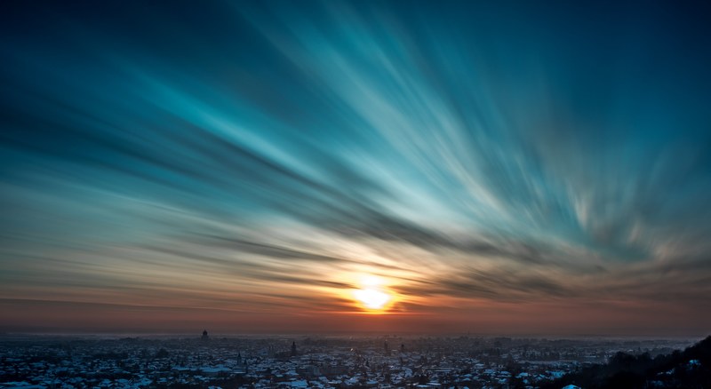 a long exposure shot of the clouds and sky at sunset over the city of baia mare romania, sunset sky over the city of baia mare 4k