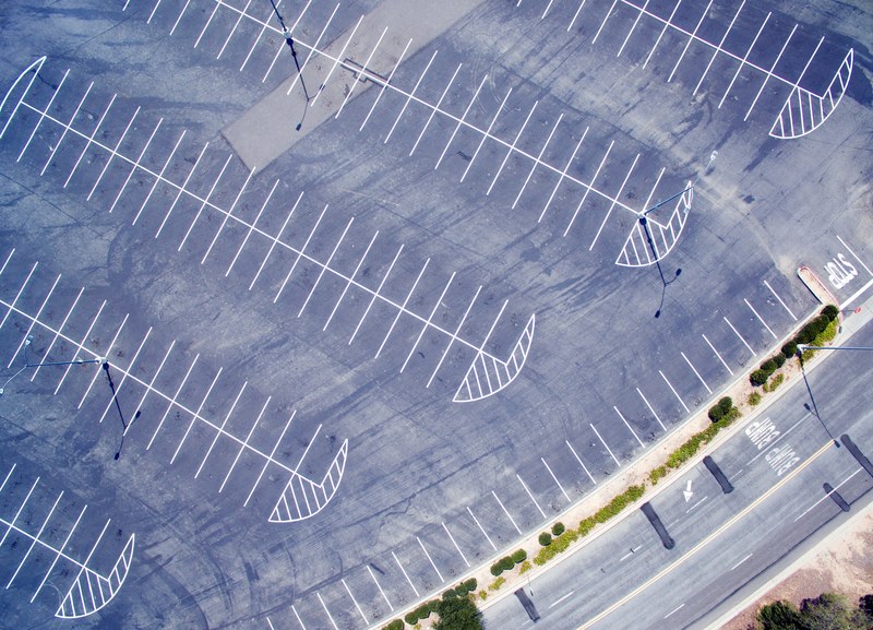a drone shot of an empty parking lot in moorpark california, drone over parking lot 4k