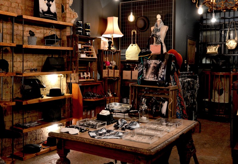 the interior of an old fashioned accessory store with hats handbags and jewelry, vintage accessory store 4k