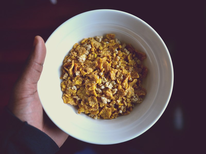 hand holding a bowl of dry cereal, bowl of cereal 4k