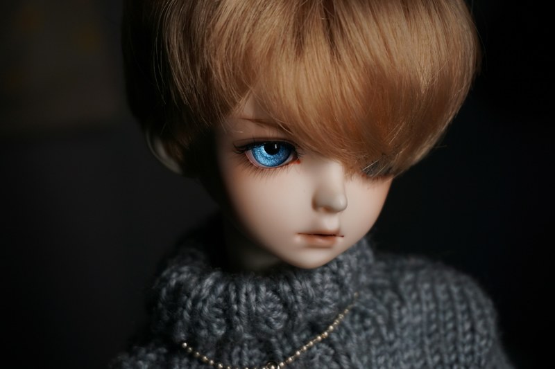 creepy realistic doll with blue eyes and swoopy hair, realistic doll 4k