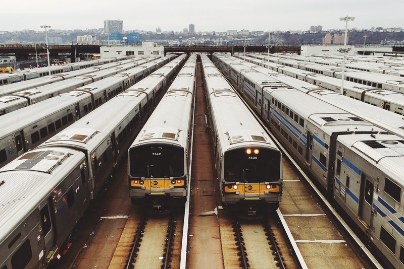 rail station with many trains on the tracks in new york, train station and tracks 4k