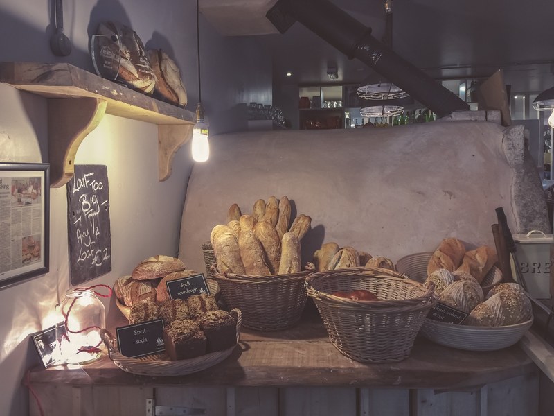 loaves of bread and baguettes in an artisanal bakery, artisan loaves of bread 4k