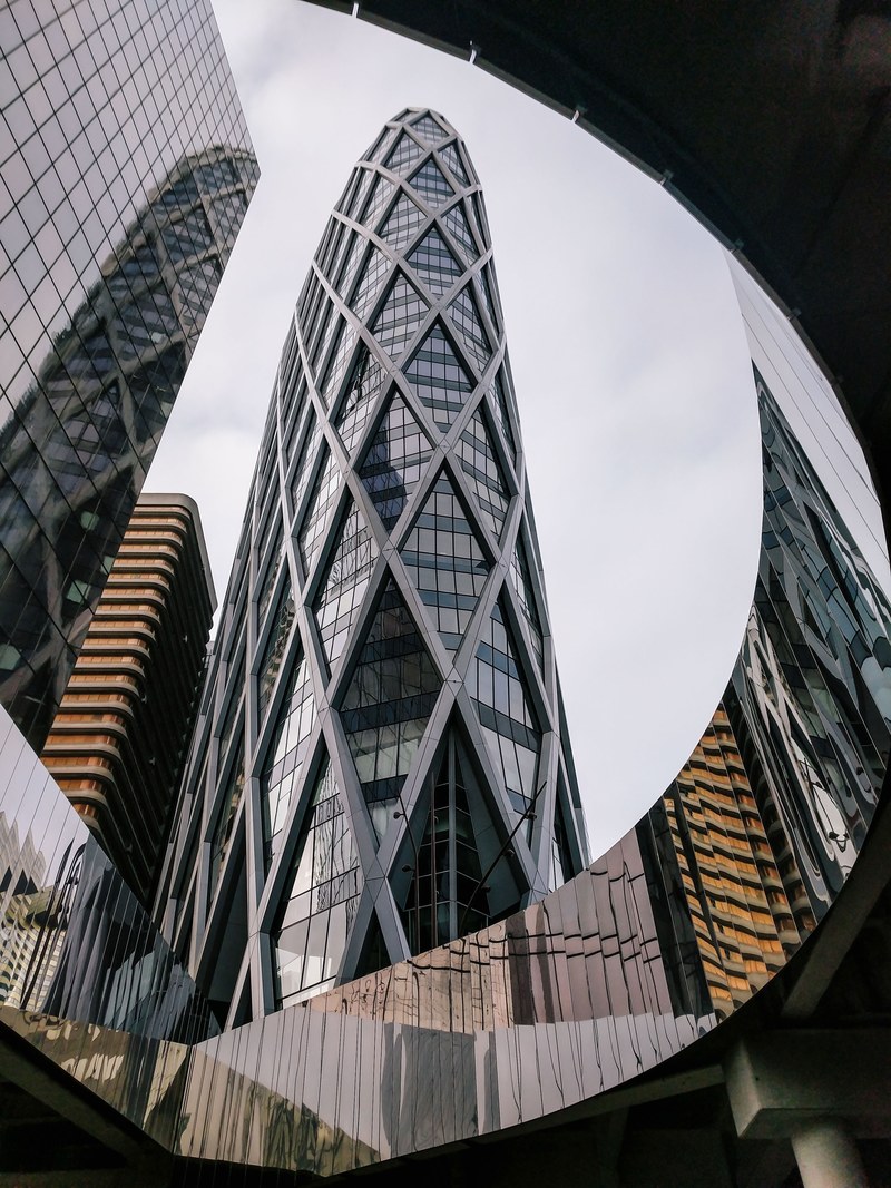 a tall modern skyscraper with a latticework facade in paris, paris buildings 4k