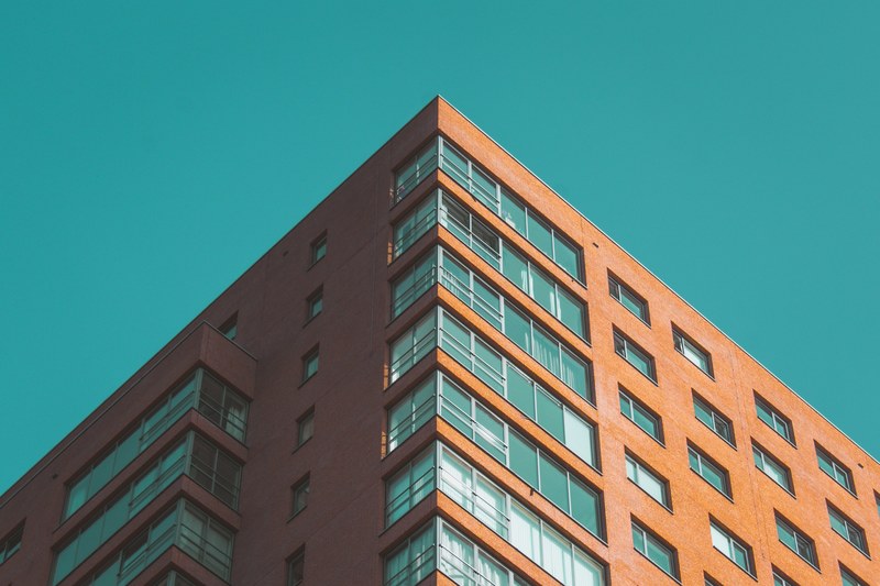 the corner of a red apartment building, red apartment building 4k