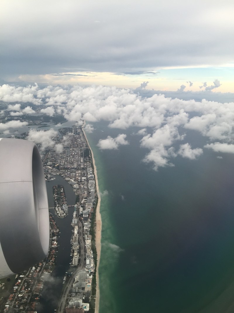 view of the miami beach coastline from an airplane, coastline view from a plane 4k