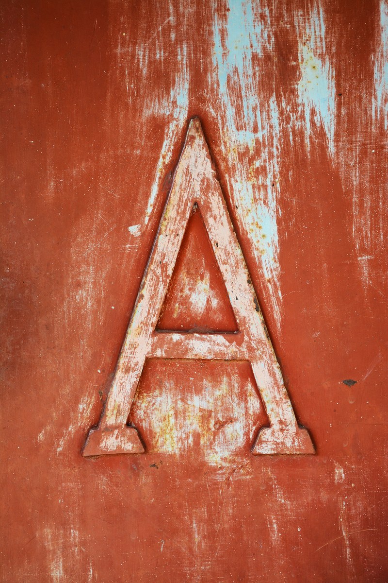 an old rusty a sign hung on an old rusty wall, rusty a 4k