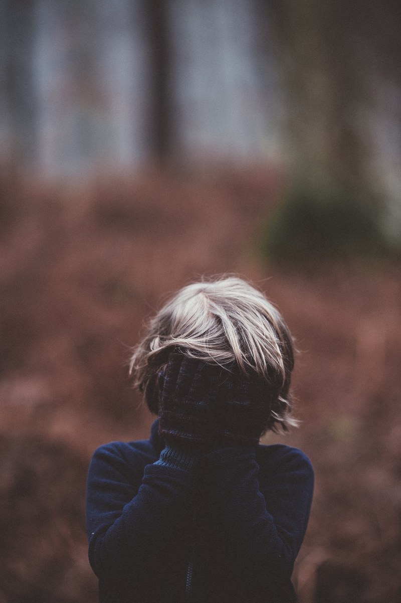 child with eyes covered 4k