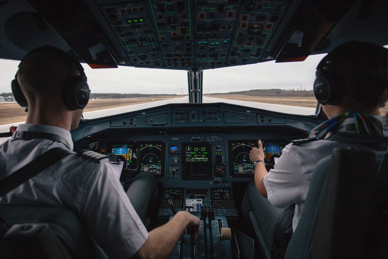 two pilots in an airplane cockpit during take off, pilots taking off 4k