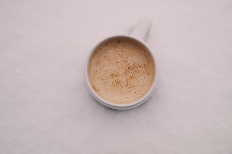 a frothy cup of coffee in a white mug in oradea, oradea coffee cup 4k