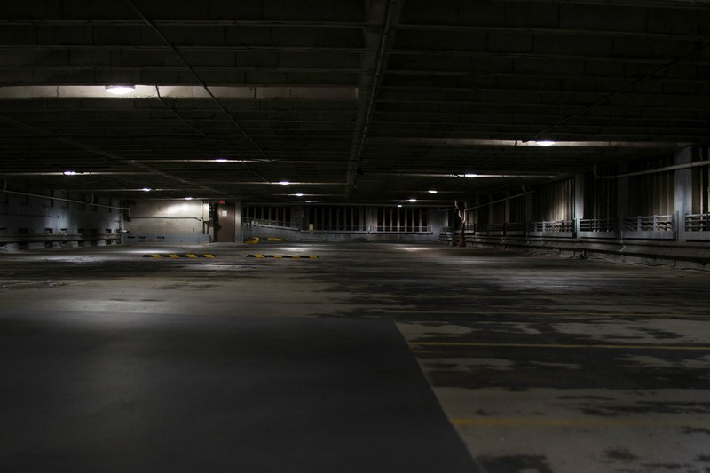 a dark empty concrete parking space in milwaukee, dark empty parking space 4k