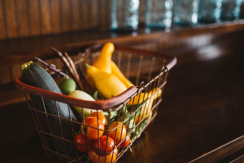 a wired basket of vegetables like tomatoes cucumber and peppers in arkansas, healthy harvest 4k