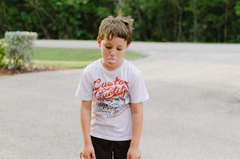 upset young boy throwing a temper tantrum and sticking his tongue out, tongue out 4k