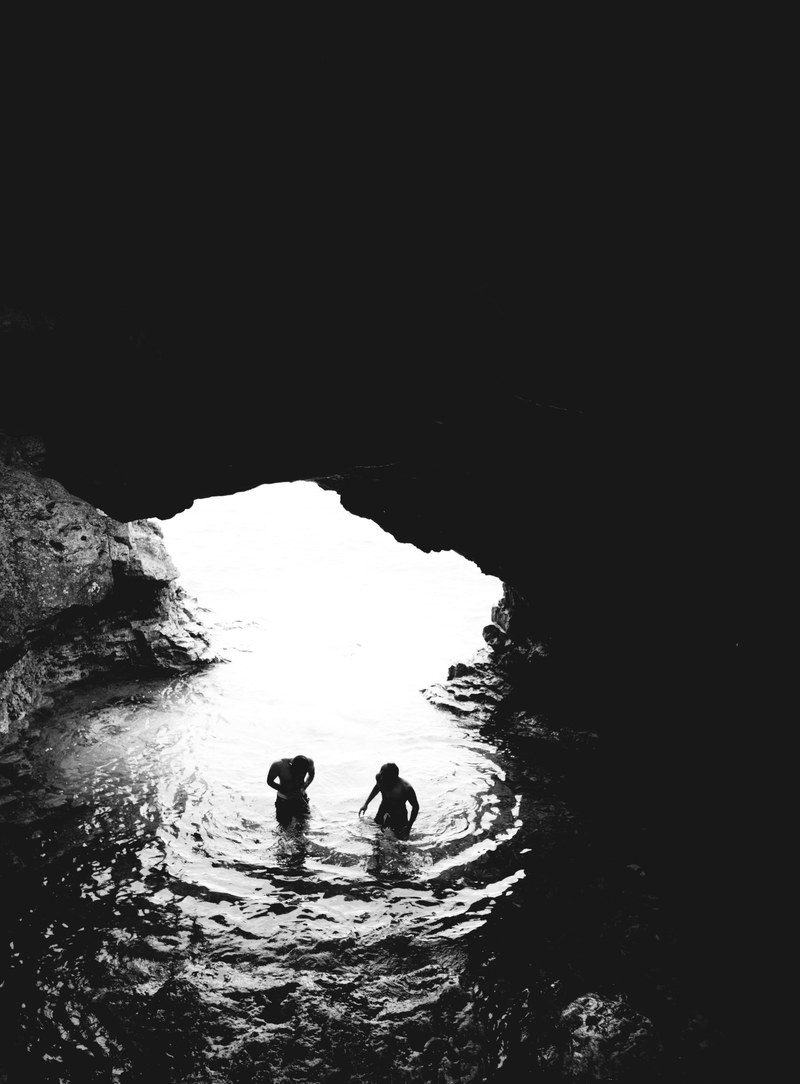 black and white shot of people in sea cave light the grotto bruce peninsula national park, sea cave at grotto bruce 4k