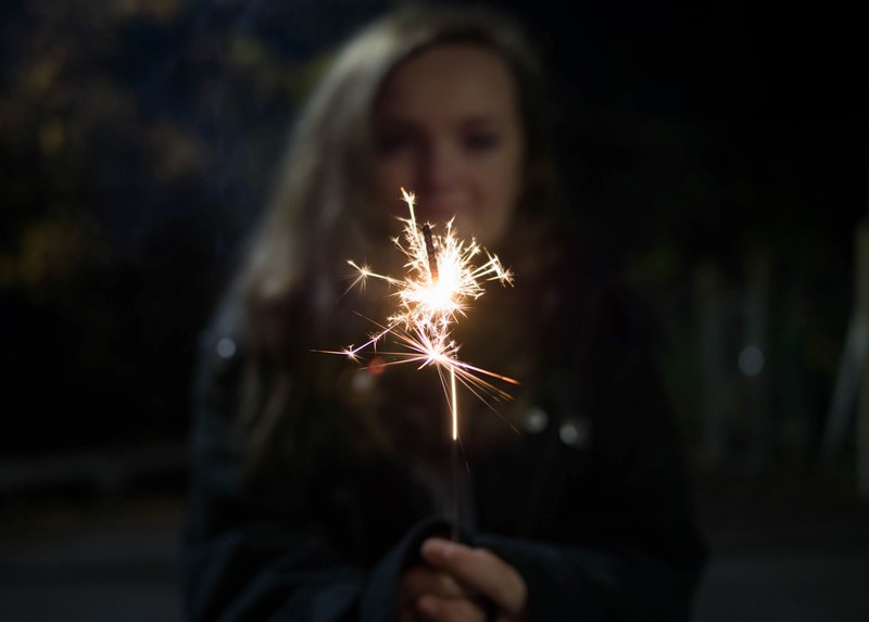 spark firework dark and holding 4k