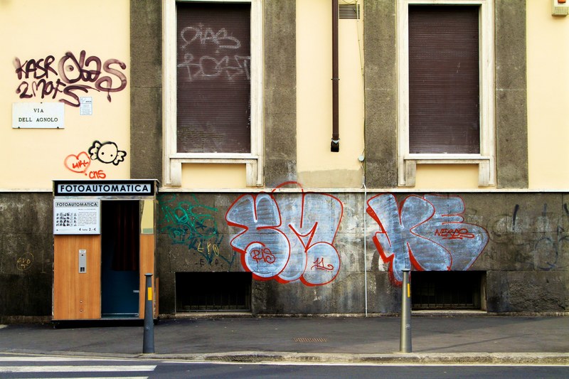 graffiti on a wall in florence next to a photo booth, photo booth and graffiti 4k
