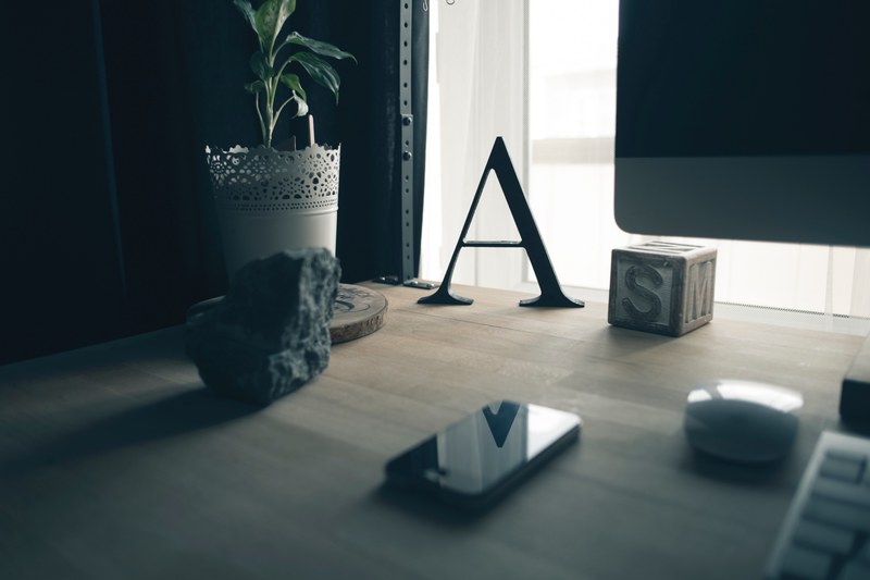 an office desk of a designer showing desktop screen mouse iphone and other things, _mouse and iphone on a desk 4k