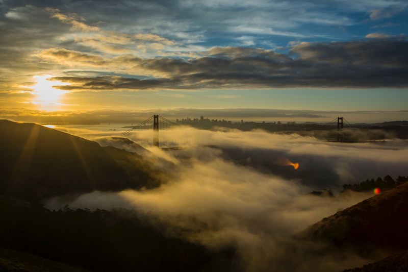 san franciscos golden gate bridge covered in fog the sun in a cloudy sky, cloud bridge golden gate bridge and san francisco 4k