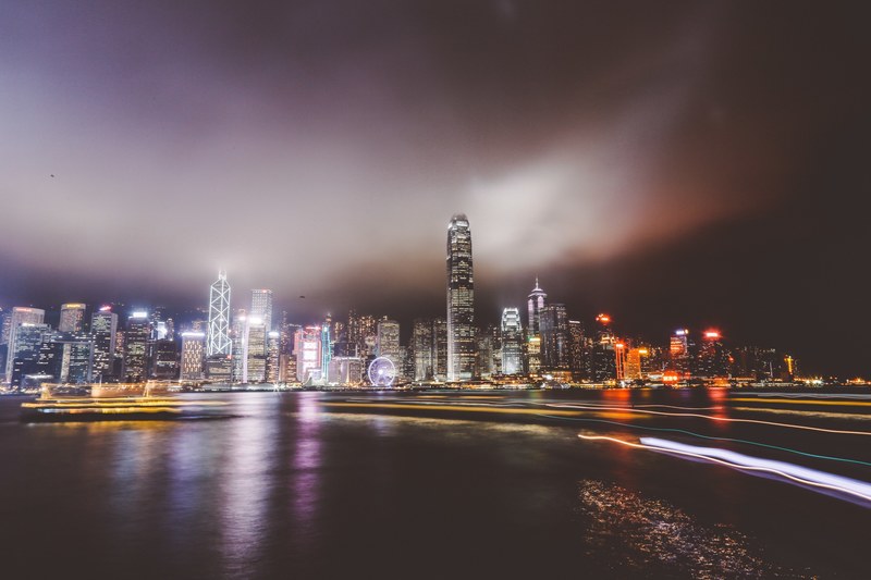 city skyline on the waterfront downtown on a foggy night, city lights at night 4k